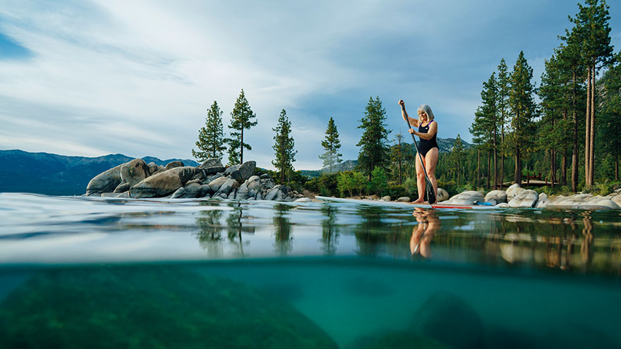 Woman paddle boarding on Lake Tahoe