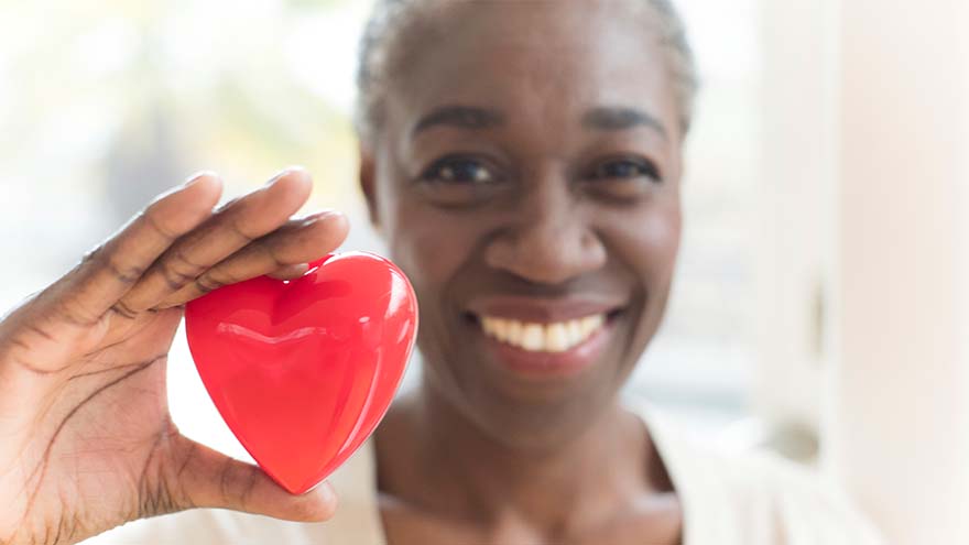 Woman holding heart shape