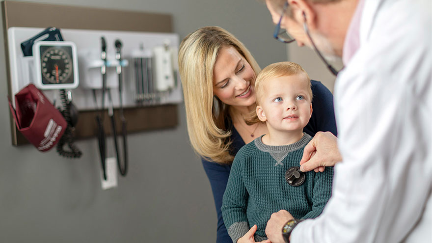 Doctor inspecting a child